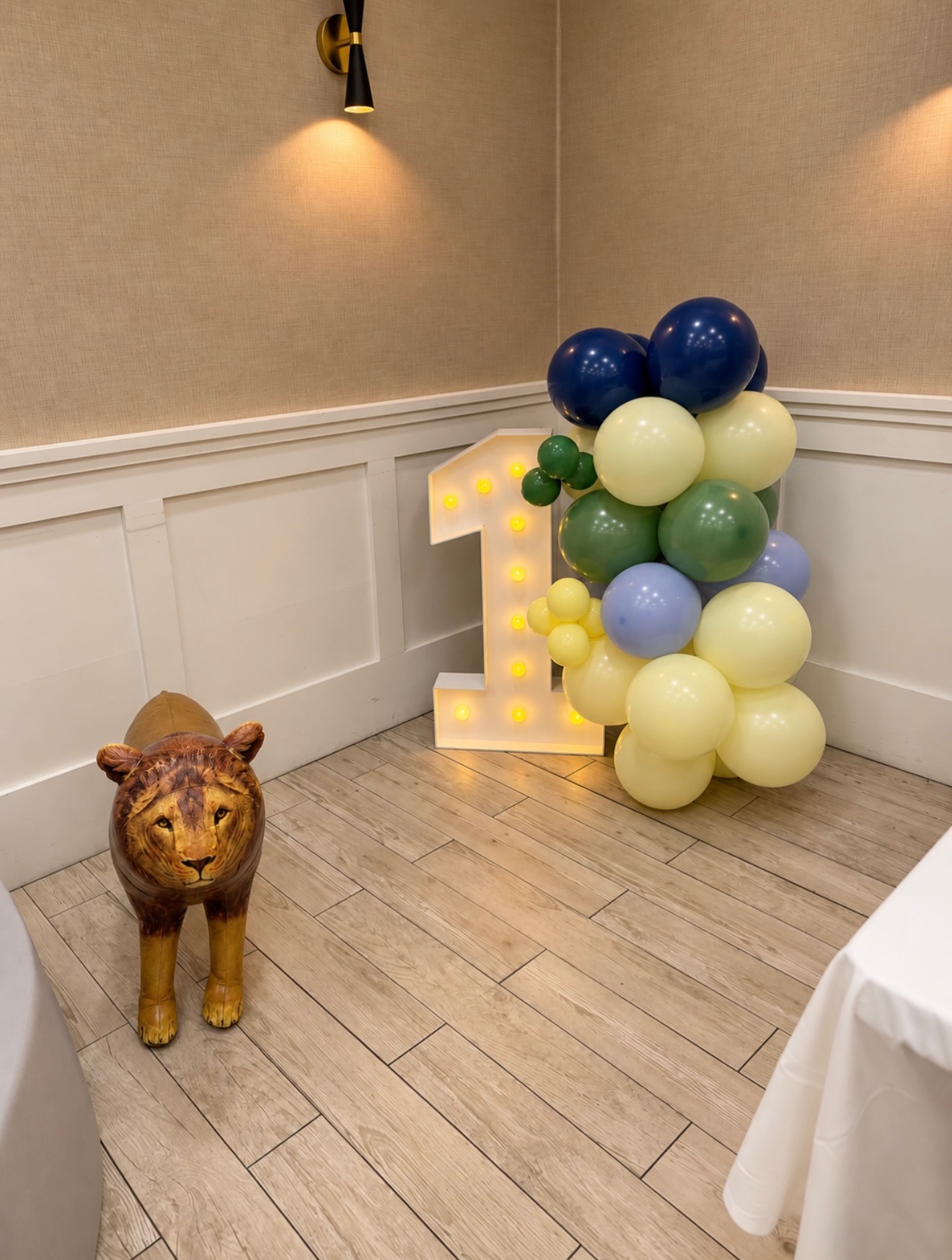 Wild One · balloons & marquee number