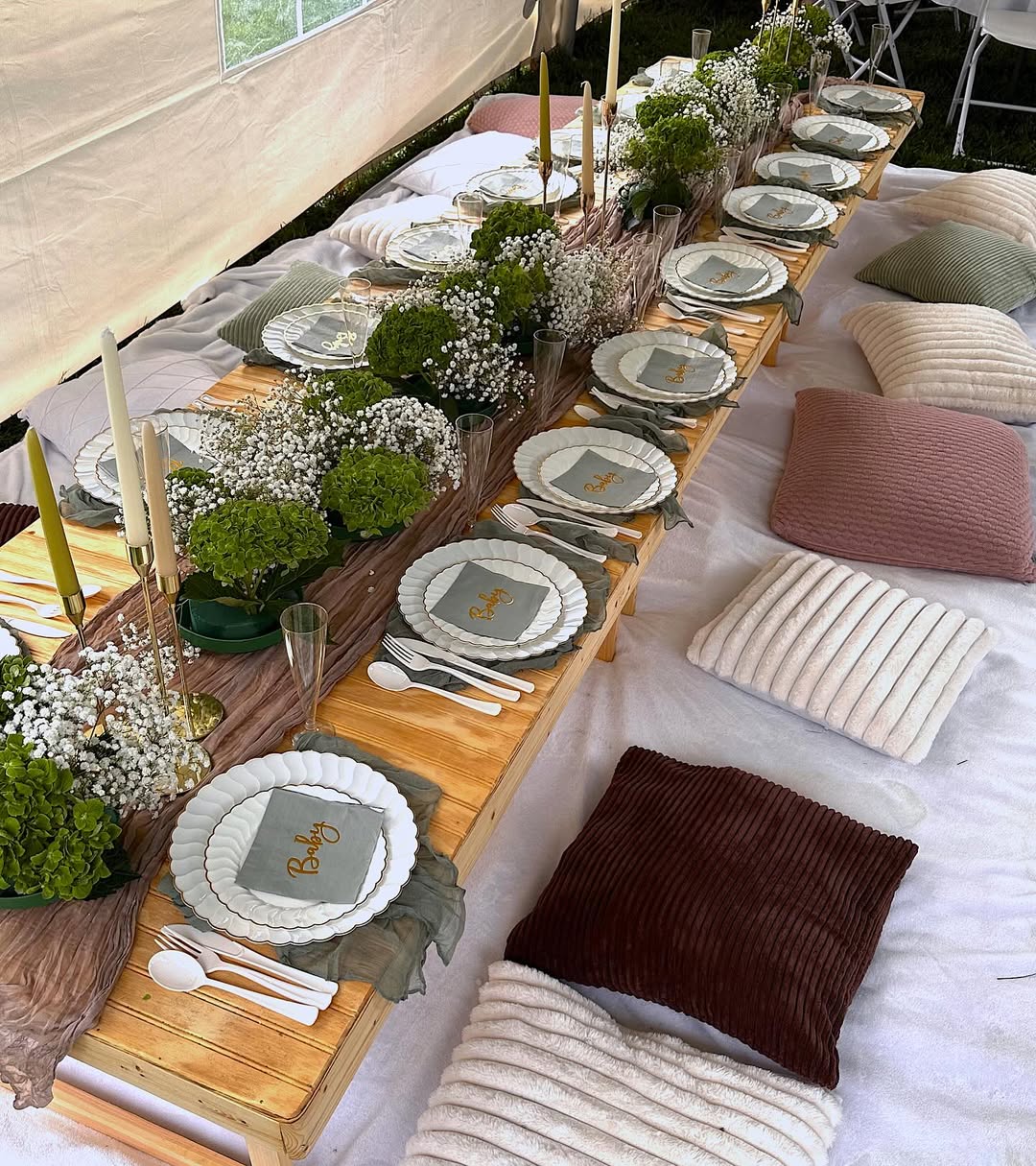 Picnic under a tent · green floral table styling