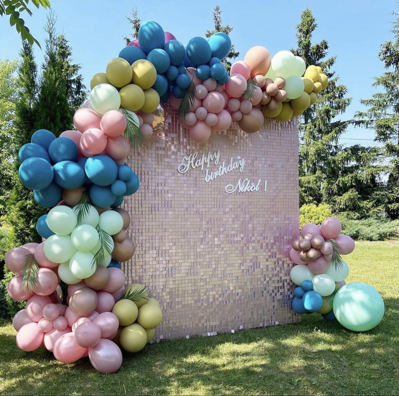 Pink shimmer panels · blue, green & pink balloons